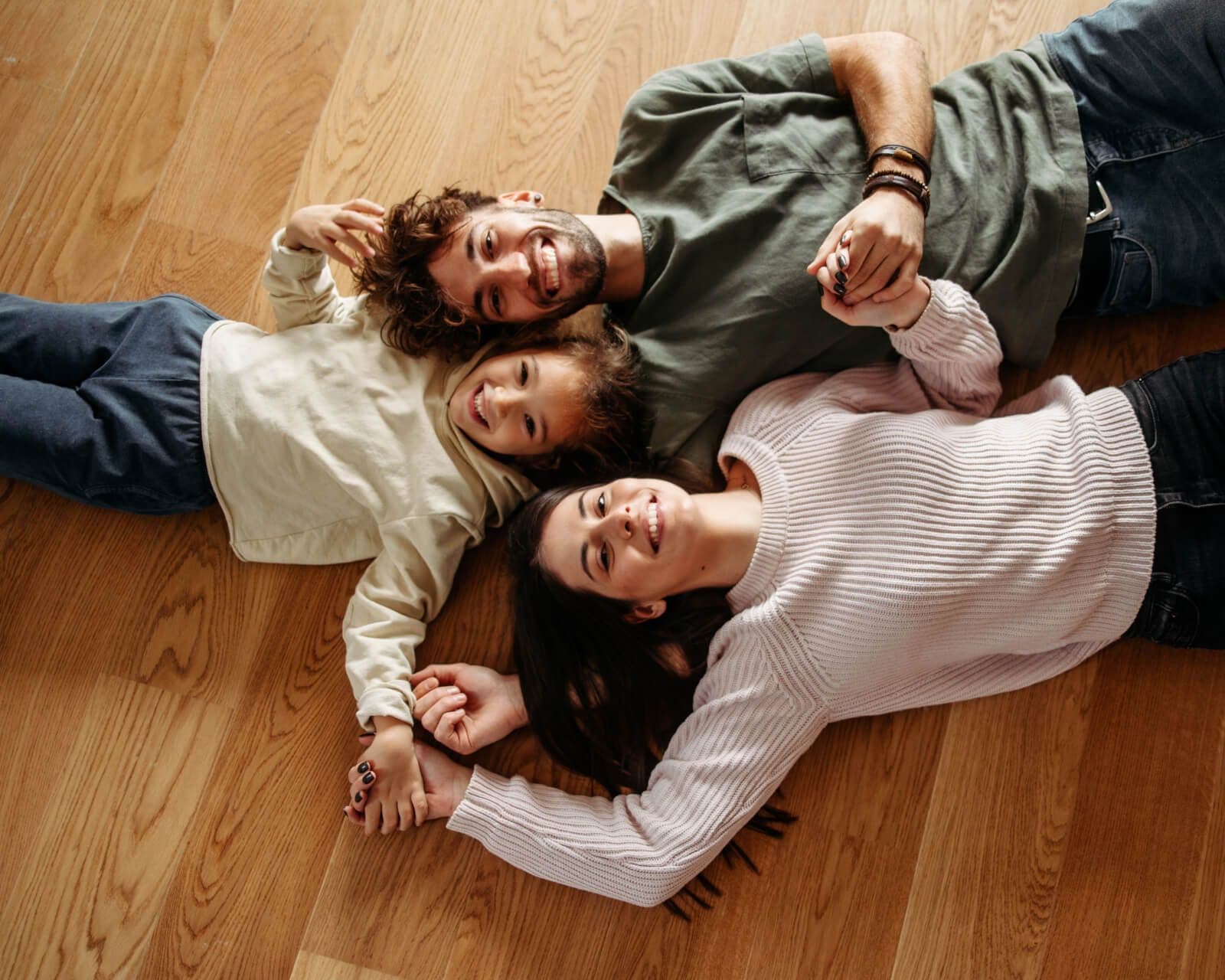 Lifetime Guarantee - Family laying on floor